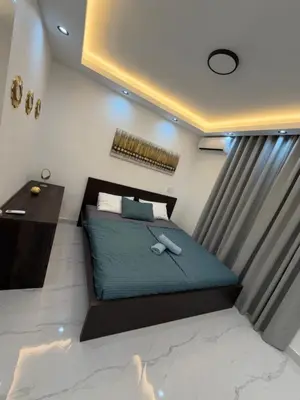 a small bedroom with a bed and a desk at Luxury NEW Stylish apartment Bayahibe with pool in Bayahibe