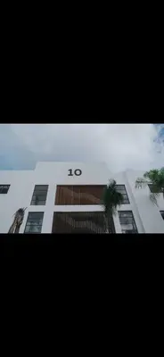 a building with the number on the side of it at Costa bávaro garden in Punta Cana