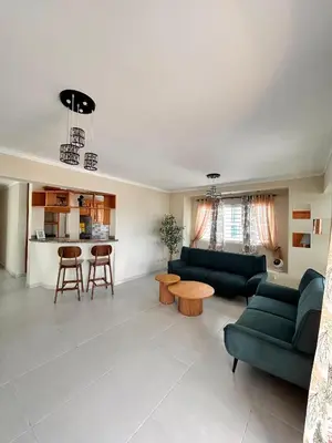 a living room with two green couches and a table at Vista del sol in La Viva