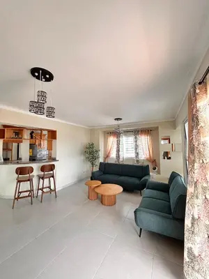 a living room with two green couches and a table at Vista del sol in La Viva