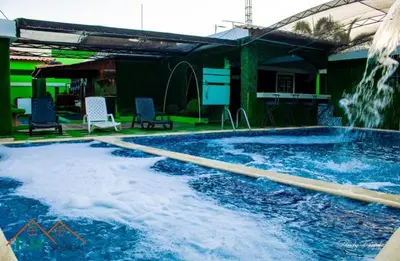 a large swimming pool with a water fountain at Remanso de Paz in Pedernales