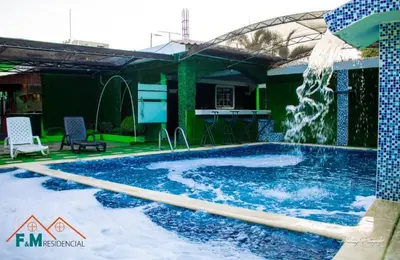 a swimming pool with a water fountain at Remanso de Paz in Pedernales