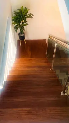 a potted plant sitting on top of a staircase at Modern Rooftop Penthouse Private Large Jacuzzi for 12 in Santiago de los Caballeros