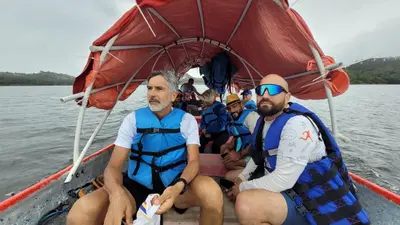 a group of people in a boat on the water at Villas del lago resort in Colorado