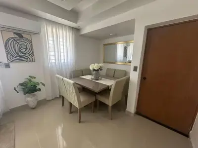 a dining room with a table and chairs and a door at Elsa in Jacagua