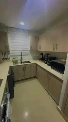 an empty kitchen with a sink and a microwave at Elsa in Jacagua