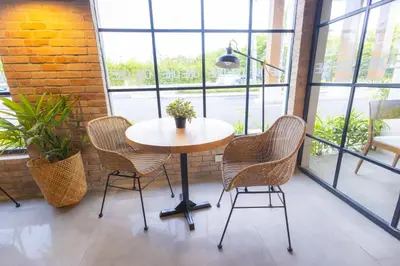 a table and chairs in a room with windows at View to paradise, One bedroom apartment in Puerto Plata