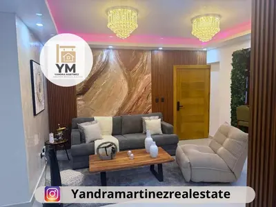 a living room with a couch and a table at Ideal amueblado, céntrico y acogedor in Los Paredones