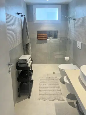 a bathroom with a shower and a toilet and a sink at Estrella Izha 204 in La Laguna
