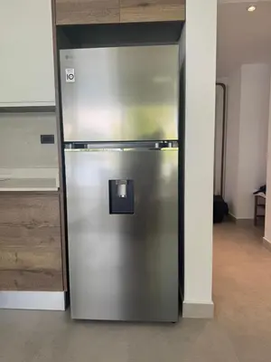 a stainless steel refrigerator sitting in a room at Estrella Izha 204 in La Laguna