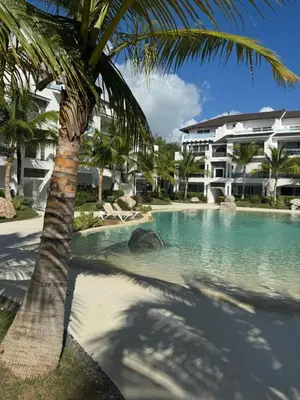 a palm tree sitting next to a swimming pool at Estrella Izha 204 in La Laguna
