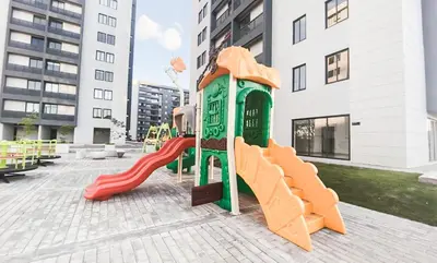 a playground in a city with a slide at Livera park in Santiago de los Caballeros
