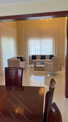 a living room with a couch and a table at Villa La Perla in Pimentel
