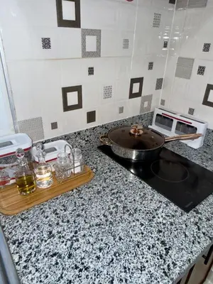 a kitchen counter top with a sink and a stove at Apartamento acogedor con cocina y balcón privado in Bayahibe