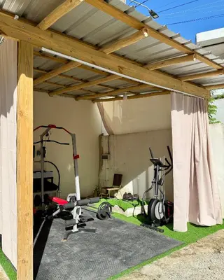 a gym with exercise equipment in a building at Residencia AKKMA - Autentico y dominicano con AC in Las Terrenas
