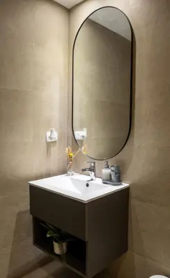 a bathroom with a sink and a large mirror at Beach Pool Jacuzzi Wifi Netflix Gym 5 Guests in Villas del Mar