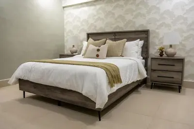 a bedroom with a large bed and two night stands at Beach Pool Jacuzzi Wifi Netflix Gym 5 Guests in Villas del Mar