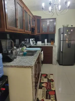 a kitchen with a sink and a refrigerator at Paris London hause in Los Grini