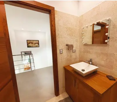 a bathroom with a sink and a mirror at Tropical VILLAGE in Las Terrenas