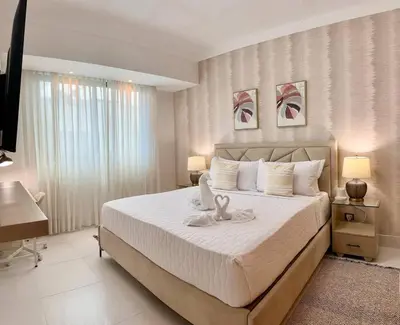a bedroom with a bed with a stuffed animal on it at Elegant City-Center Luxury Apt in Santo Domingo
