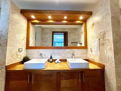 two sinks in a bathroom with a mirror at Modern 2BD With Pool And Huge Private Terrace in Las Terrenas