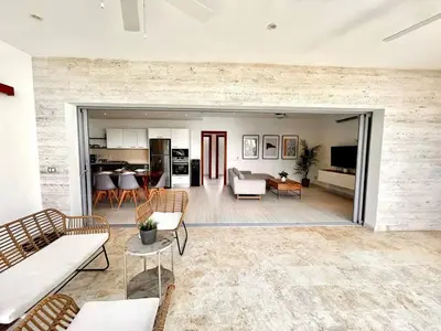 a living room with a couch and chairs and a table at Modern 2BD With Pool And Huge Private Terrace in Las Terrenas