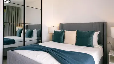 a bedroom with a bed with a large mirror at Caribbean Heaven in Punta Cana