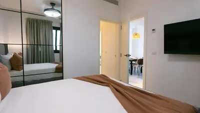 a hotel room with a bed and a large mirror at Caribbean Heaven in Punta Cana