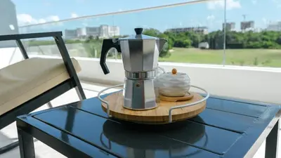 a coffee maker sitting on a table on a table at Caribbean Heaven in Punta Cana
