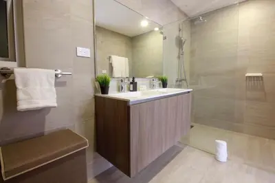 a bathroom with a sink and a shower at New Apartment! Beach getaway at Hard Rock in Punta Cana