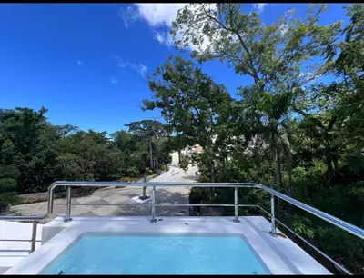 a hot tub on the balcony of a house at Mireyas Sweet Escape with private Jacuzzi in Las Terrenas