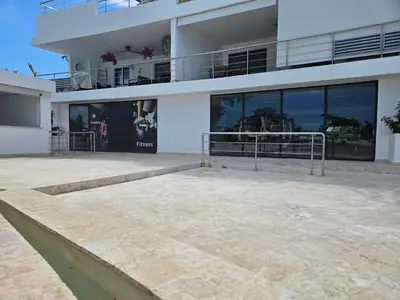 a large building with a walkway in front of it at Mireyas Sweet Escape with private Jacuzzi in Las Terrenas