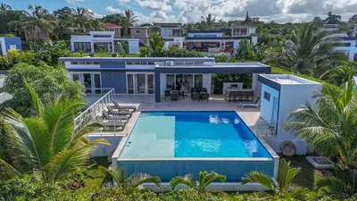 an aerial view of a house with a swimming pool at AC in Living Room, Infinity, Pool Luxury in Sosúa