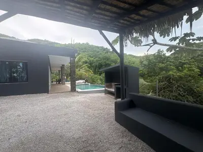 a house with a view of a swimming pool at Villa Palacio Verde in Las Terrenas