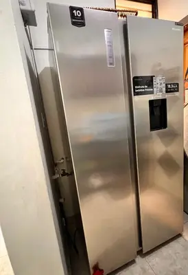 a stainless steel refrigerator in a kitchen at Alojamiento cerca de Agora y Blue Mall y Cine etc in Santo Domingo