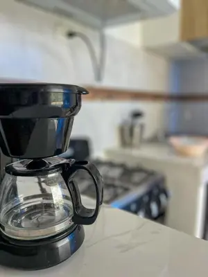 a coffee pot sitting on top of a counter in a kitchen at Ocean Vibes - Bayahibe in Bayahibe