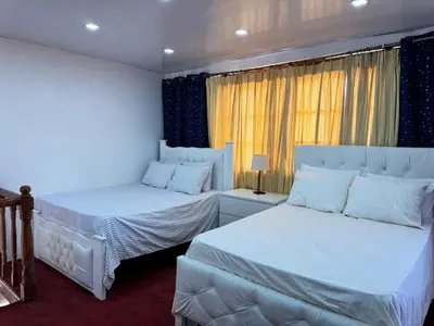 a bedroom with two beds and a window at La placita in Santa Bárbara de Samaná