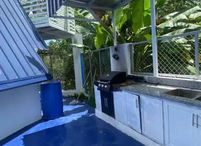 a kitchen with a sink and a counter top at Villa Machepa