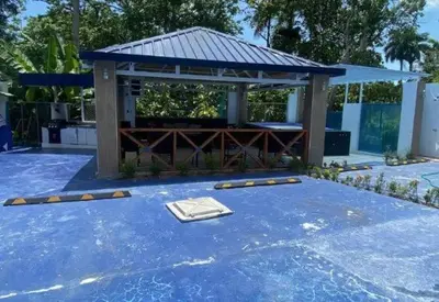 a gazebo with a table in the middle of a yard at Villa Machepa