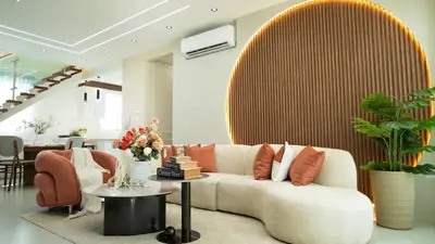 a living room with a couch and a table at Luxurious PH, Near Airport,Private Jacuzzi in Santiago de los Caballeros