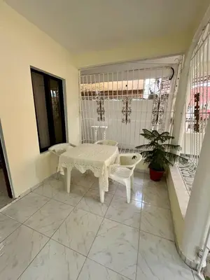 a white room with a table and a chair at Apartamento in Boca Chica