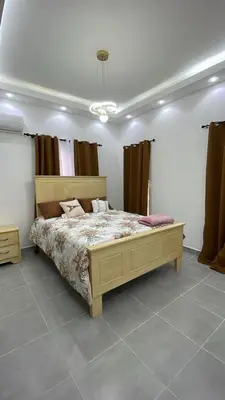 a bedroom with a large bed in a room at Villa macao in Punta Cana