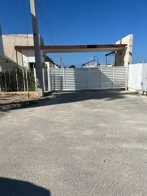 a white fence in front of a building at Villa macao in Punta Cana