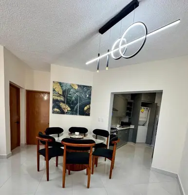 a dining room with a table and chairs at Your ideal escape in Puerto Plata Beach and fun in San Felipe de Puerto Plata