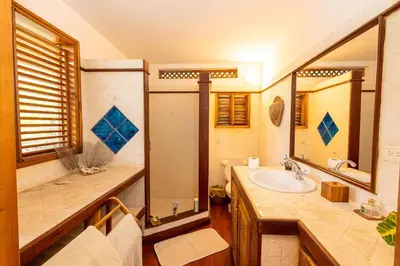 a bathroom with a sink and a mirror at Villa Aurore Las Terrenas, Las Ballenas beach in Las Terrenas