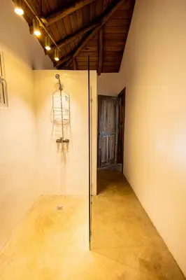 a room with a glass wall with a chair in it at Villa Aurore Las Terrenas, Las Ballenas beach in Las Terrenas