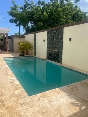 a swimming pool in front of a building at House with Pool and Calm in La Romana