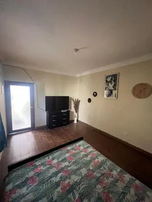a living room with a television and a rug at House with Pool and Calm in La Romana