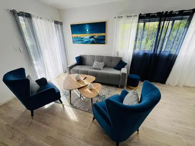 a living room with a couch and chairs and a table at Your ideal getaway awaits! in Punta Cana