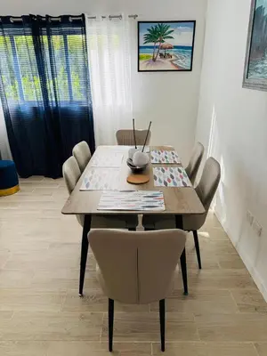 a dining room table with chairs and a table and a table and chairsktop at Your ideal getaway awaits! in Punta Cana